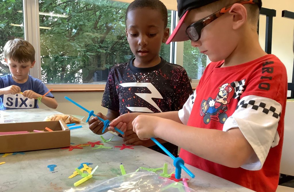 two young boys working together during a STEAM or STEM program