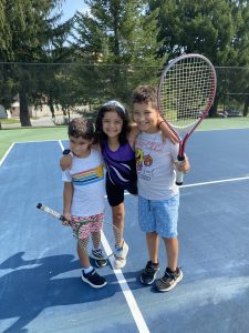 A photo of 3 kids during All Sports day program